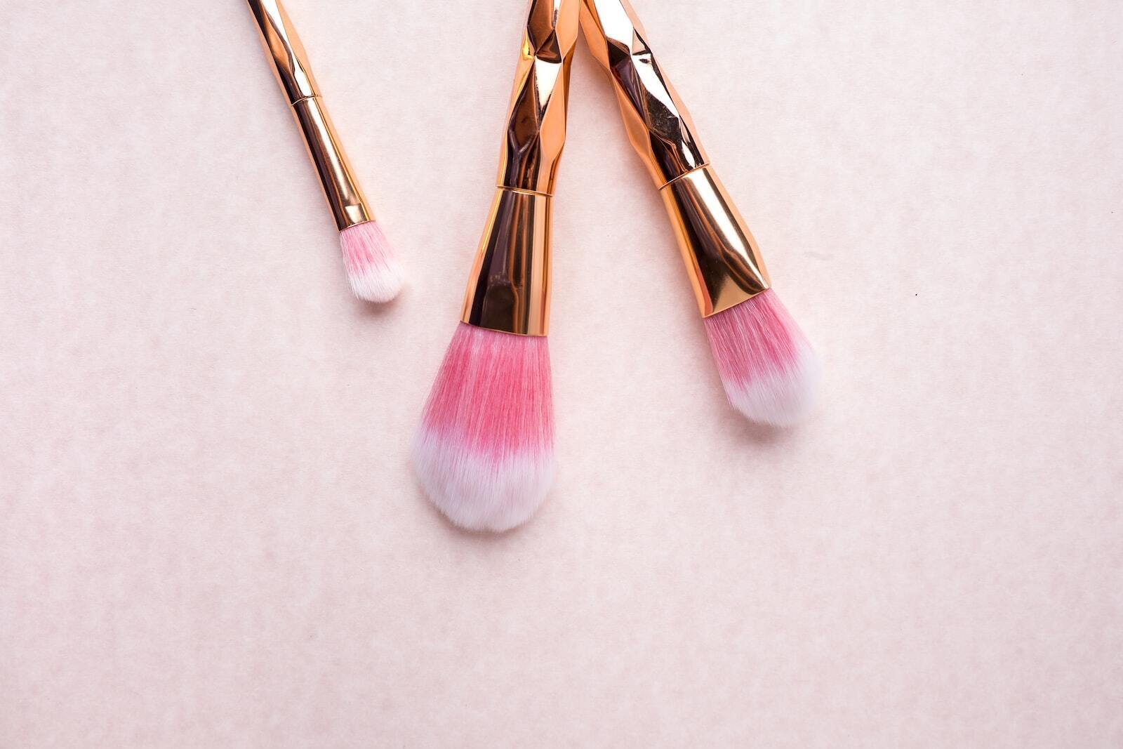 gold-colored makeup brushes