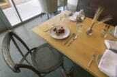 white ceramic plate and silver flatware on table