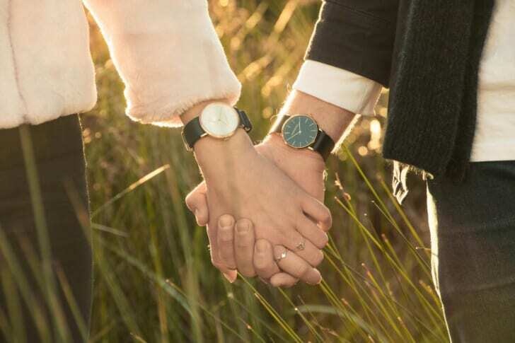 woman and man hand holding